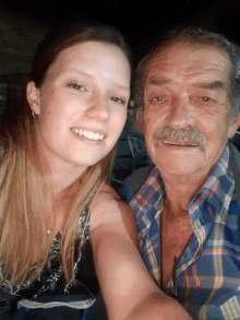 a man and a woman posing for a picture together