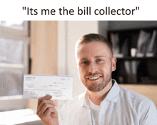 a man is holding a check that says company inc. on it