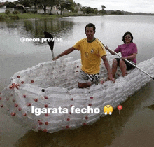 a man and woman in a boat made out of plastic bottles