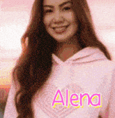 a woman wearing a pink hoodie that says alena on it