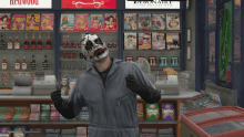 a man wearing a joker mask stands in front of a display of magazines including a redwood