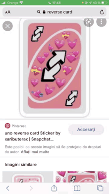 a phone screen shows a reverse card with hearts and arrows