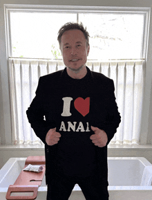 a man is wearing a black shirt that says i love anal