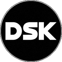 a black circle with the word dsk in white on it