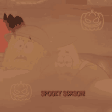 a spooky season sign with spongebob and patrick on it