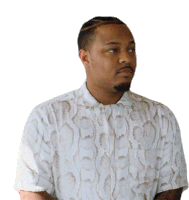 a man wearing a white shirt with a snakeskin pattern