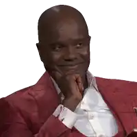 a man in a red suit has his hand on his chin and smiles