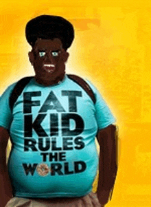 a fat kid rules the world movie poster with a man wearing a blue shirt .