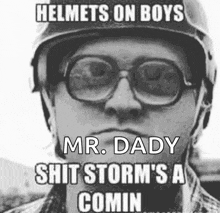 a man wearing glasses and a helmet says " helmets on boys mr. daddy shit storm 's comin "