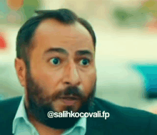 a man with a beard is making a funny face with the words @ salihkocovali.fp written below him