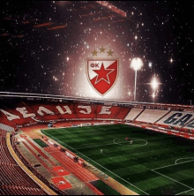 an empty soccer stadium with a red and white logo that says ok