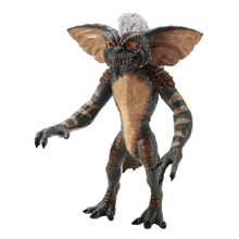 a figurine of a gremlin from the movie gremlins is standing on a white background