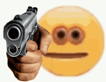 a person holding a gun in front of a smiley face