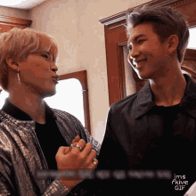 a couple of men standing next to each other with the words jms fkive gif in the corner