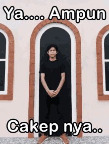 a man standing in front of a door with the words ya ampun cakep nya on the bottom