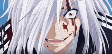 a close up of a person with blood on their face and white hair .