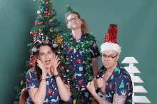 a woman with curlers in her hair and a man wearing a santa hat