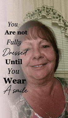 a woman is smiling with the words " you are not fully dressed until you wear a smile " behind her