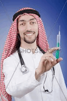 a man in a keffiyeh is holding a syringe and smiling