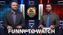 two men in suits and ties are sitting in front of a screen that says smite pro league