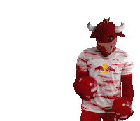 a man in a bull costume is holding a ball