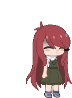 a girl with long red hair is wearing overalls