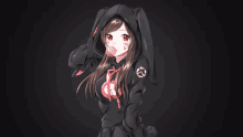 a girl wearing a black hoodie with bunny ears