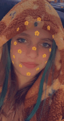 a girl with flowers on her face is wearing a teddy bear hooded jacket