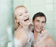 a man and a woman are taking a shower together