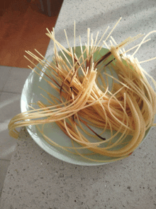 a pile of spaghetti on a white plate