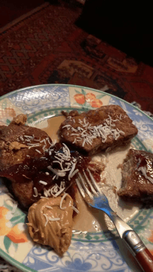 a plate of food with peanut butter and coconut shavings on it