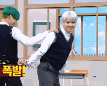 a boy with green hair is hugging another boy with white hair in a classroom