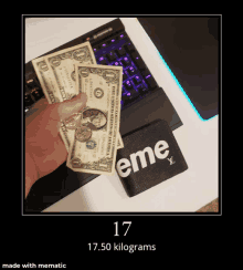 a person holding a bunch of money next to a wallet that says eme