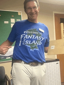 a man in a blue shirt that says welcome to fantasy island