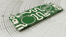 a green circuit board with rt2 on it