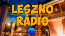 a yellow sign that says leszno radio in front of a blurry building