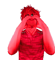 a man with red hair making a heart shape with his hands