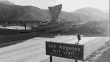 a sign that says los angeles city limit is on the side of the road