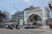 people riding motorcycles in front of a university of islam malang building