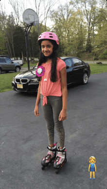 a young girl wearing roller skates and a helmet