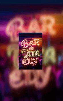 a neon sign that reads bar de tata eddy