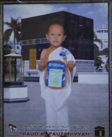 a picture of a young boy in front of a kaaba says " paud al fauziyyah " on the bottom