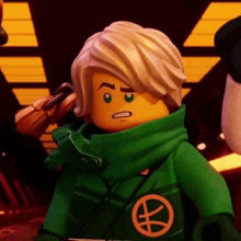 a close up of a lego ninjago character wearing a green jacket .