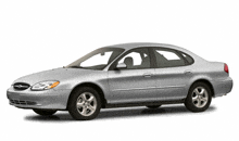 a silver ford taurus with a white background