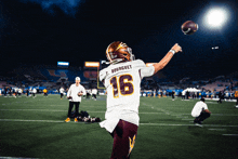 a football player named t. bourguet is about to throw the ball