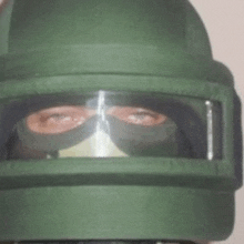 a close up of a person wearing a helmet with goggles on .