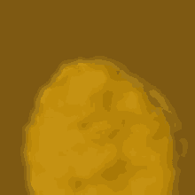 a close up of a yellow circle on a brown background .