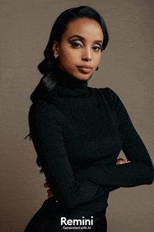 a woman wearing a black turtleneck stands with her arms crossed in front of a remini logo