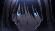 a close up of a person 's face with glowing blue eyes .