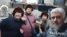 a group of men are posing for a picture with faceapp written on the bottom right